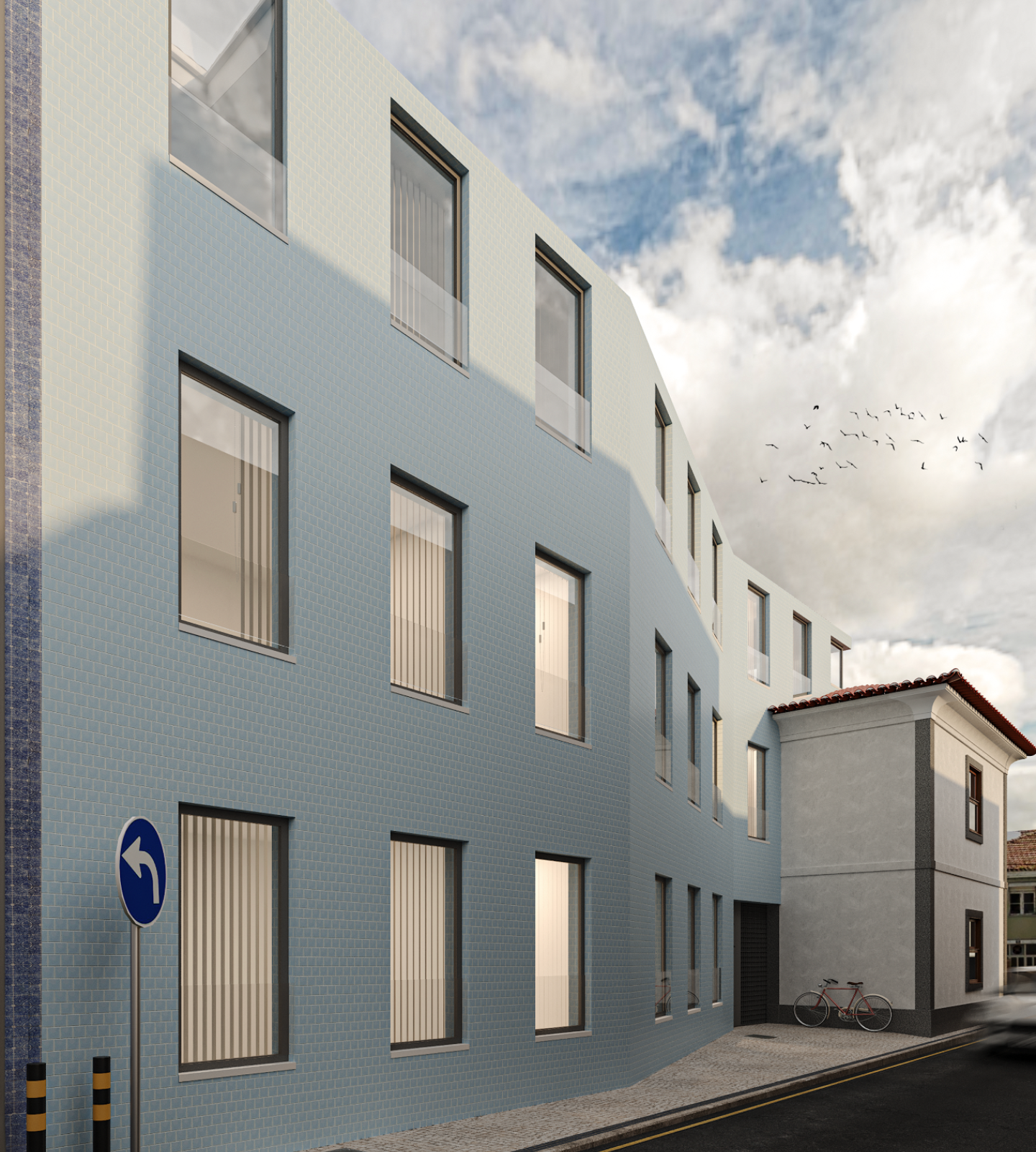 Fachada da Casa Lusitana com revestimento em azulejo azul integrada na malha urbana de Aveiro - obra Contracta