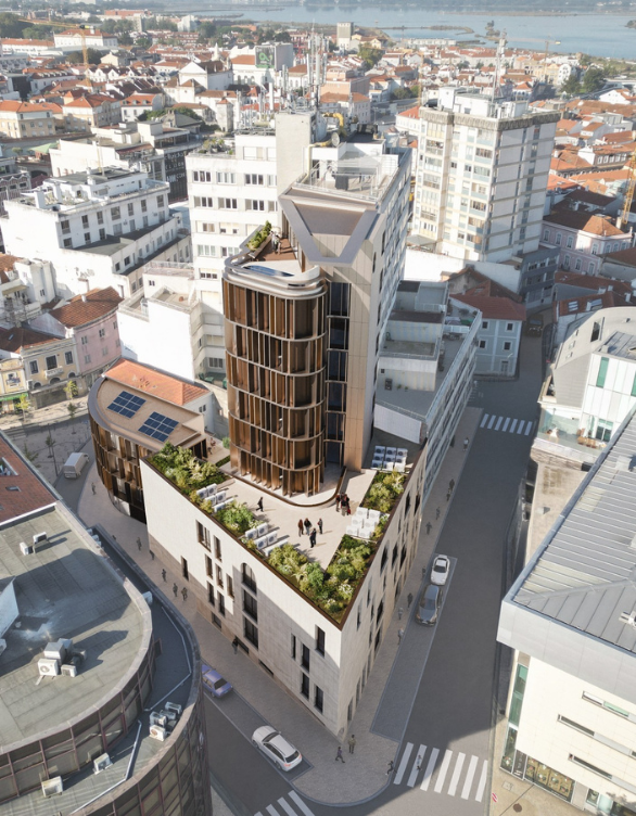 Vista aérea do Edifício Luminea no centro de Aveiro com torre e terraço ajardinado - construção Contracta Engenharia